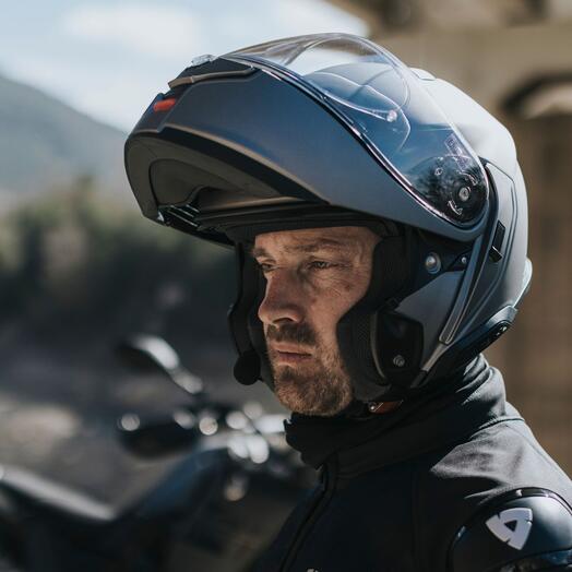 SHOEI NEOTEC 3 on a man in a mountain scene