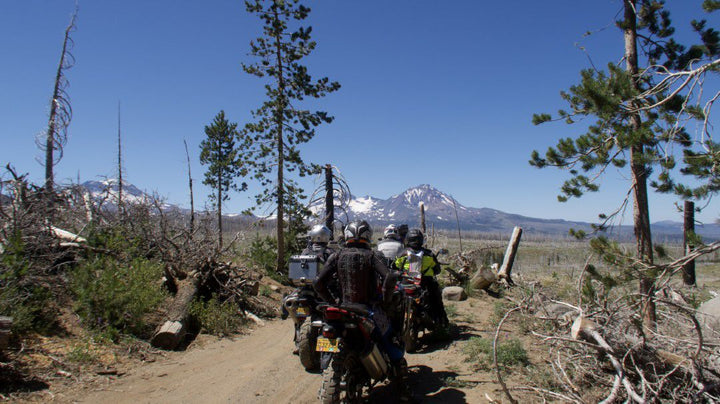 Adventure Motorcycle Riders look at the Cascade mountains on RIDE Adventures off-road training.